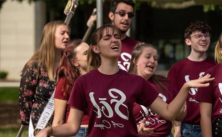 Photo of BW Student Singing in Sol A Capella Group